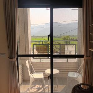 a view of a balcony with a table and chairs at Kiutaro 2 in Yuli