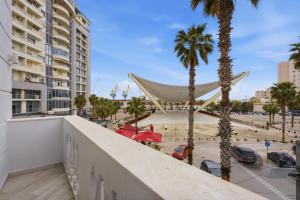 a view from the balcony of a building with palm trees at Hotel Giulia in Durrës