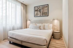 Un pat sau paturi într-o cameră la Hotel Ciencias Select