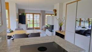 a kitchen and dining room with a table and chairs at Ferienhaus Mind-Storm in Rimsting