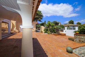 a patio of a house with a pillar at Spacious Private Villa with Pool in Salou in Salou