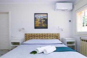 a bedroom with a bed with two towels on it at Spacious Private Villa with Pool in Salou in Salou +31 photos