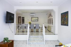 a living room with a staircase and a dining room at Spacious Private Villa with Pool in Salou in Salou