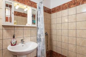a bathroom with a sink and a shower at Mulberry Cottage in Samos +37 photos
