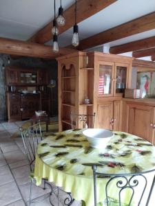 a kitchen with a table with a bowl on it at Le fourezon in Saint-Jeures
