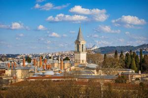 a city with a tall building with a tower at Le Safran Palace in Istanbul