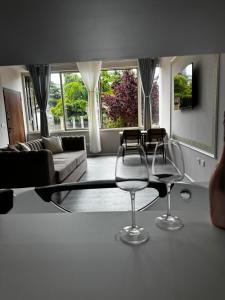 a living room with two chairs and a glass table at Forum View 2 in Durrës