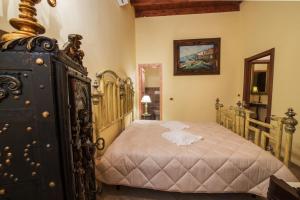 En eller flere senger på et rom på B&B Trani Palace