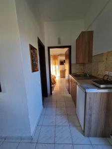 a kitchen with a sink and a counter top at Paradise studios in Nikiti
