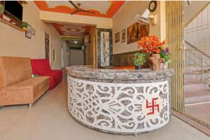 a living room with a lobby with a reception counter at Shri Mangal Palace in Gwalior
