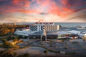 an aerial view of a hotel with a parking lot at The Capital Boardwalk in Gqeberha +40 photos