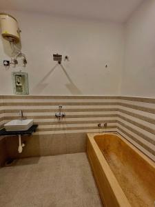 a bathroom with a bath tub and a sink at L2 Darbar Kothi Heritage Living in Jodhpur