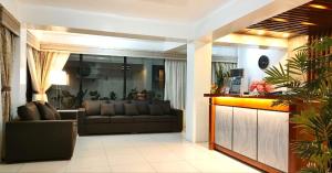 a living room with a couch and a table at ZKB Twins Hotel in General Santos