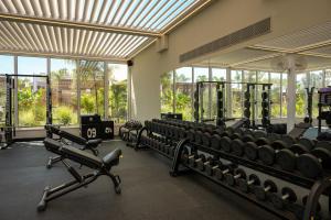 a gym with rows of chairs and windows at Mitsis Faliraki in Faliraki