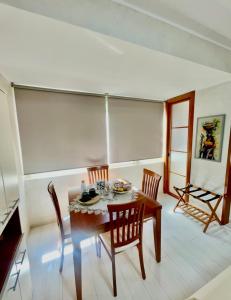 a dining room with a table and chairs at Mirabilia in Maratea +6 photos