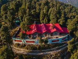 an aerial view of a house with red roofs at Tree Heaven Resort-Kanatal in Kanatal