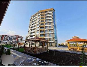 a gazebo in front of a tall building at Ankara Esenboğa Airport Comfort Apart in Ankara