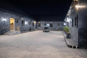 a car parked inside of a building at night at The Whale Inn Narayi rd Barnawa high cost in Kaduna