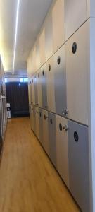 a row of lockers in a locker room at CaiPods Backpacker Hostel by G10 Guest House Bandung in Bandung