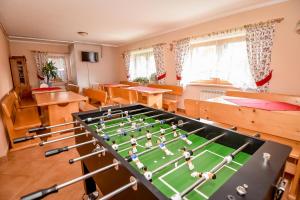 a room with a foosball table in a classroom at Pod Wyciągiem Harenda in Zakopane +204 photos
