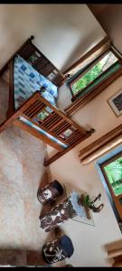 an overhead view of a room with two bunk beds at Bageecha B&B- V A A Y U in Alībāg