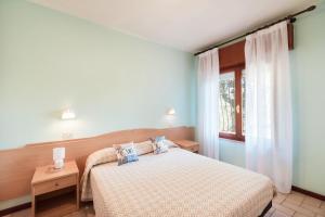 a bedroom with a bed and a window at Residence azzurro VISTA MARE-A in Gabicce Mare