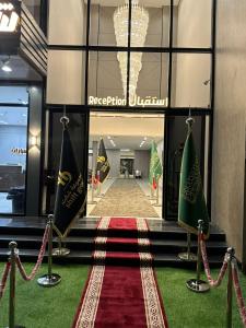 a lobby of a hotel with a redusalem dublin flag at فندق شفت جازان Shift Jizan Hotel in Jazan