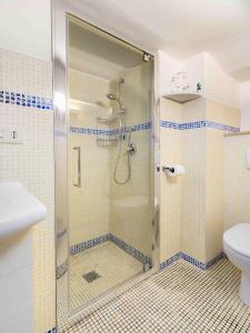 a bathroom with a shower and a toilet at Casa Alberi in Volterra +8 photos