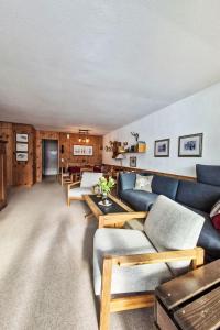 a living room with couches and a table at Apartment Apt A 086 by Interhome in Disentis
