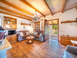a living room with a couch and a table at Holiday Home Can Niu by Interhome in Pollença