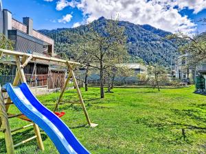 a playground with a slide in a park at Apartment Christine by Interhome in Prutz