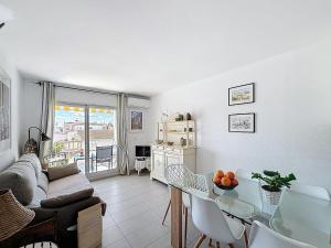 a living room with a glass table and a couch at Apartment Pattaya-8 by Interhome in Empuriabrava