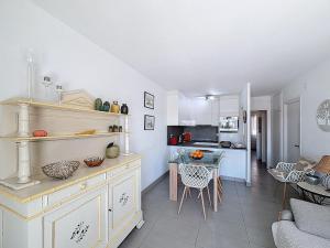a kitchen and living room with a table and a dining room at Apartment Pattaya-8 by Interhome in Empuriabrava +22 photos