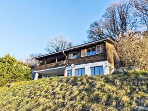 a house on top of a hill at Apartment Crap Grisch by Interhome in Ruschein