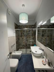 a bathroom with a sink and a toilet and a shower at San Pietro Otranto in Otranto +38 photos