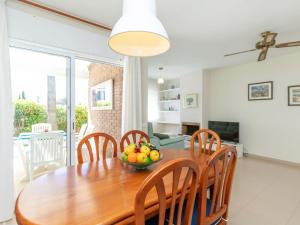 a dining room table with a bowl of fruit on it at Holiday Home Canyadell by Interhome in Torredembarra