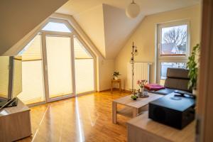 a living room with a couch and a table at Ferienwohnung Schultz in Zinnowitz