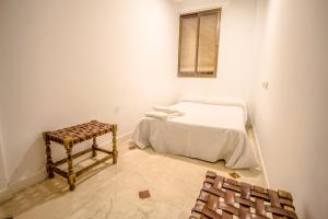 Postel nebo postele na pokoji v ubytování Hostal Bocanegra