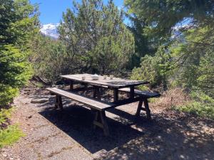 a picnic table with cups and candles on it at Chalet Veni- Vidi- Mansi by Interhome in Champex