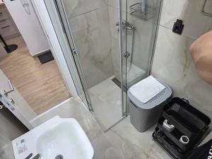 a bathroom with a shower and a sink at Apartmani Optimist in Valjevo +54 photos