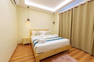 a bedroom with a bed in a room at Mandala Living Kathmandu in Kathmandu