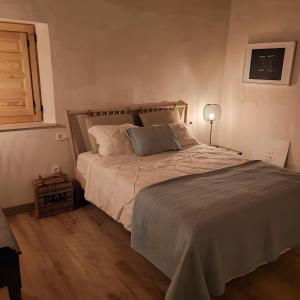 a bedroom with a large bed with a wooden floor at El Limonar in Murcia +15 photos