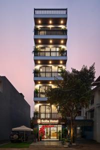 a tall building with a lot of lights on it at Solla Hotel in Ninh Binh