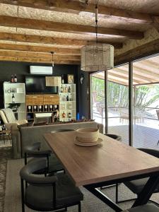 a dining room with a wooden table and chairs at Pablo's place in Rezine