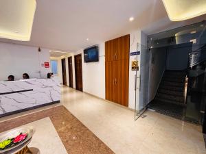 a hallway with a staircase in a building at Hotel shivay palace in Rishīkesh