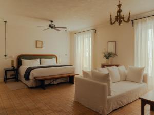 a bedroom with a bed and a couch at Portella Palma in Palma de Mallorca +93 photos
