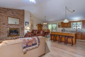 a living room with a couch and a fireplace at Home Away From Home · Home-Away-From-Home in Rosman