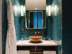 a bathroom with a sink and a mirror at The Dean Galway in Galway