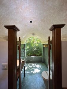 a bathroom with a tub and a toilet in a room at Dunes Unawatuna Hotel in Unawatuna +148 photos
