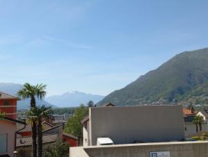 a view of a city with mountains in the background at Casa Willo in Bellinzona